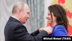 Президент России Владимир Путин и главный редактор агентства «Россия сегодня» и телеканала «Russia Today» Маргарита Симоньян (иллюстративное фото)