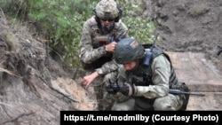 Найміт ПВК «Вагнэр» зь беларускім салдатам на тэрыторыі Беларусі