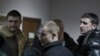 Міліцыянты, якія праходязць па справе аб масавых беспарадках у якасьці пацярпелых