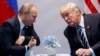Президент Дональд Трамп (справа) и президент России Владимир Путин на саммите «Большой двадцатки» в Гамбурге 7 июля 2017 года. Архивное фото