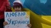 Қырым татарларының Ресейге қарсы шеруіне плакат ұстап шыққан бала. 